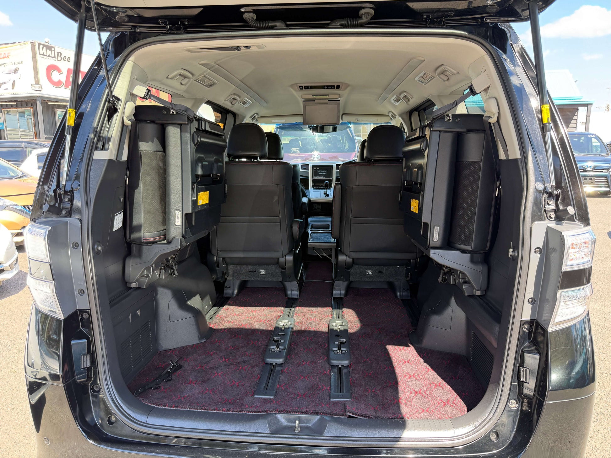 Interior view of the 2013 Toyota Vellfire 2.4L Z Golden Eyes Edition showing spacious 7 seats arrangement.