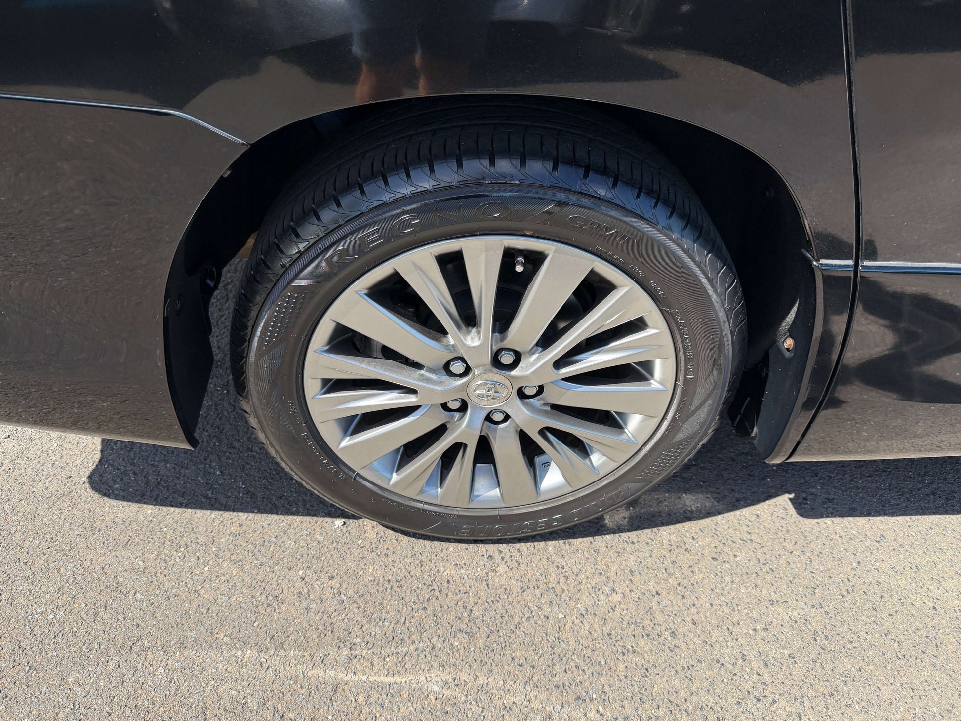 Close-up of a stylish alloy wheel on a black 2013 Toyota Vellfire 2.4L Z Golden Eyes Edition.