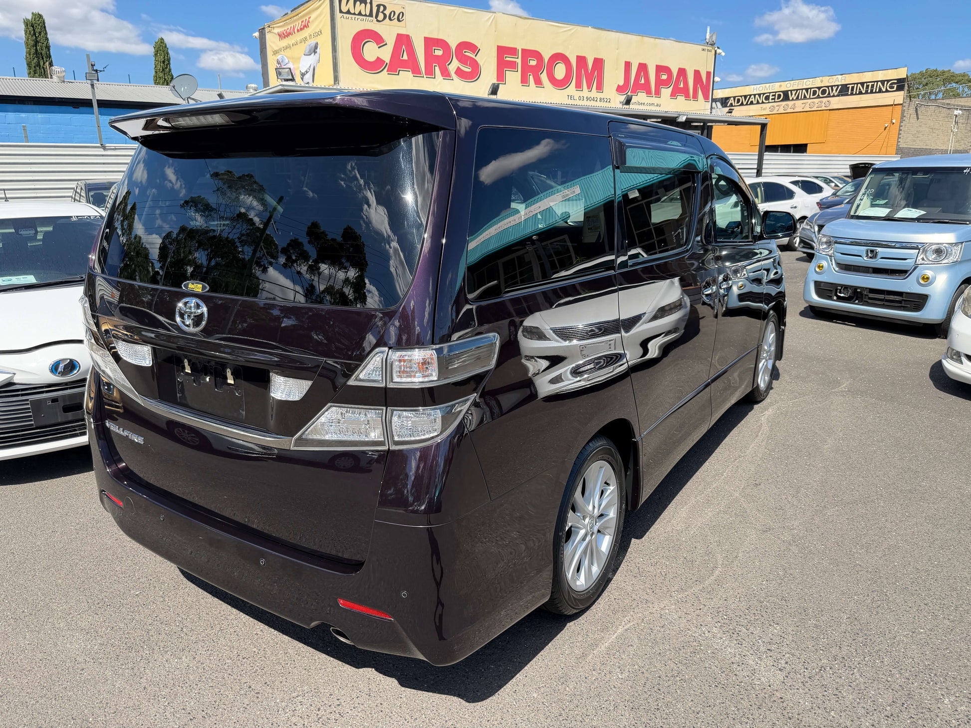 2009 Toyota Vellfire 2.4L Z Edition, rear view of luxury people mover at car dealership.