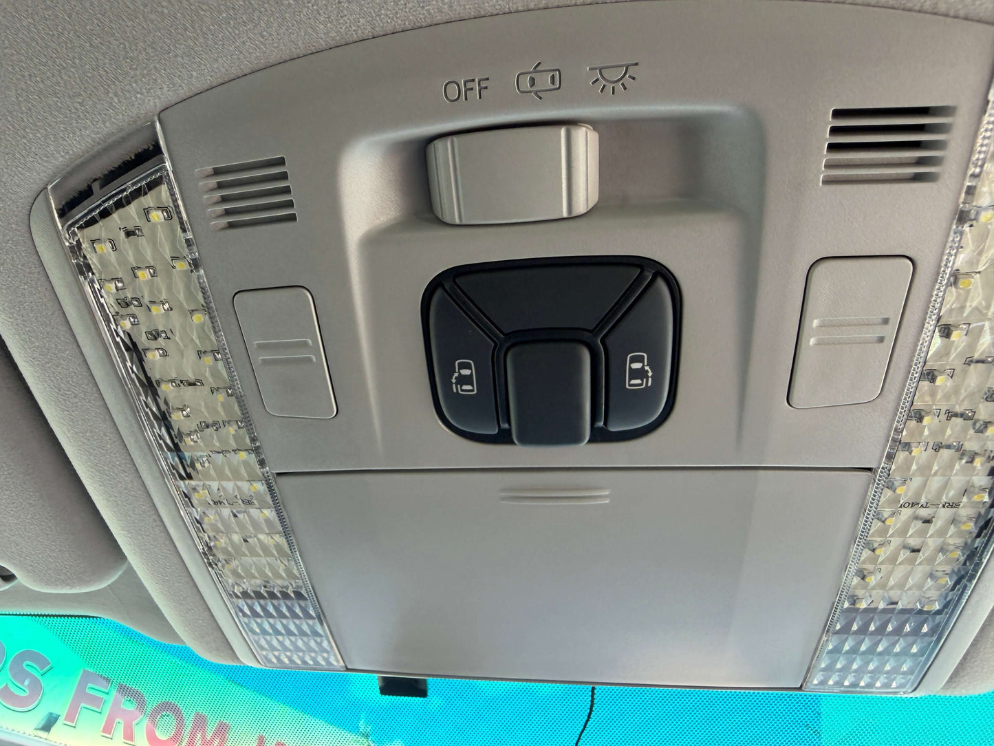 Interior view of the 2009 Toyota Vellfire 2.4L showing overhead controls and lighting features.