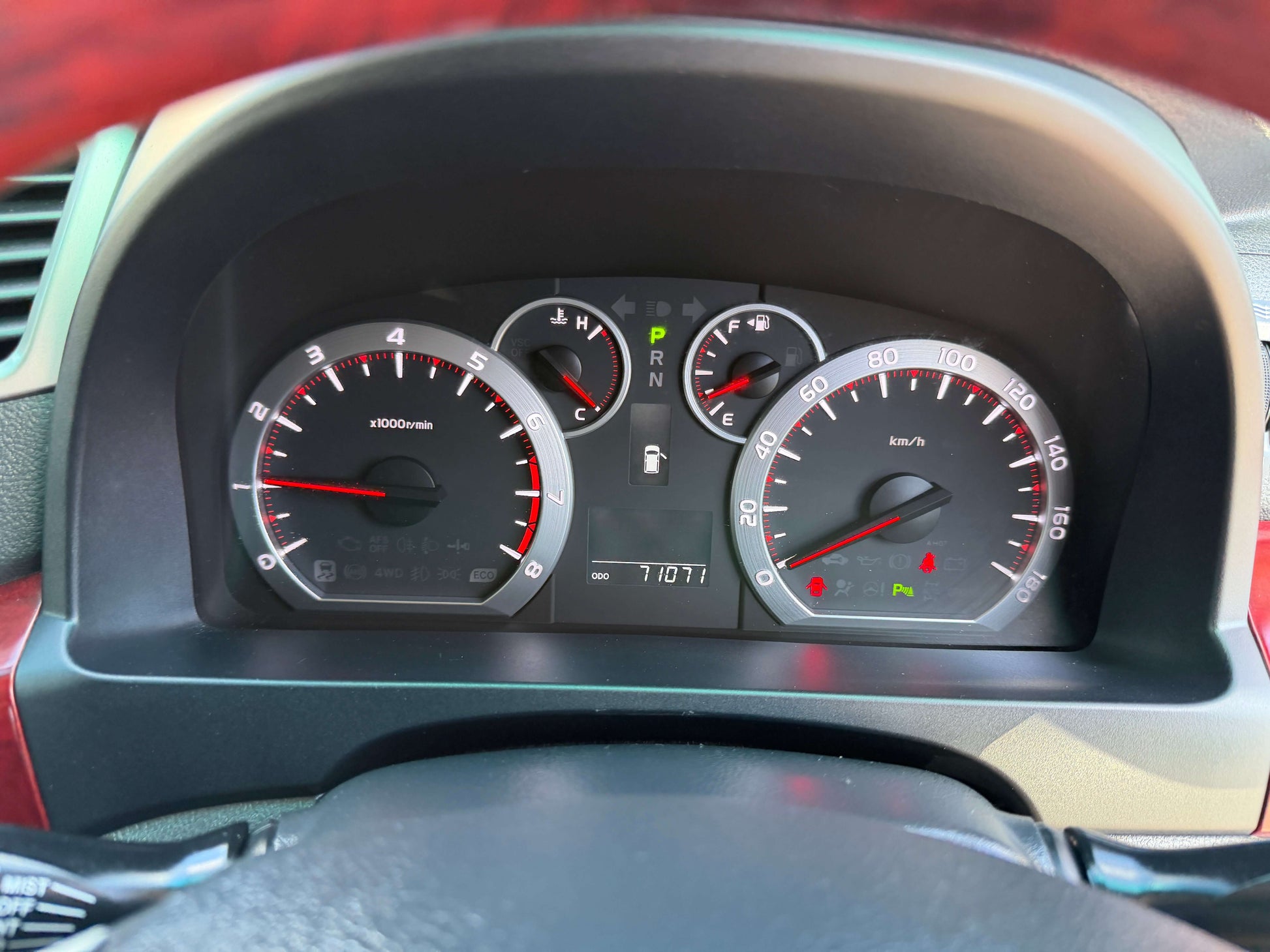 2009 Toyota Vellfire 2.4L dashboard showing speedometer and fuel gauge with mileage of 71071 km.