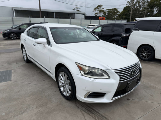 2013 Lexus LS460 AWD V8 4.6L Premium Luxury Sedan in white, showcasing sleek design and premium features.