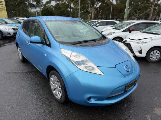 2015 Nissan Leaf 24kW G-Edition Full Electric, a blue electric car parked, showcasing its sleek design and eco-friendly features.