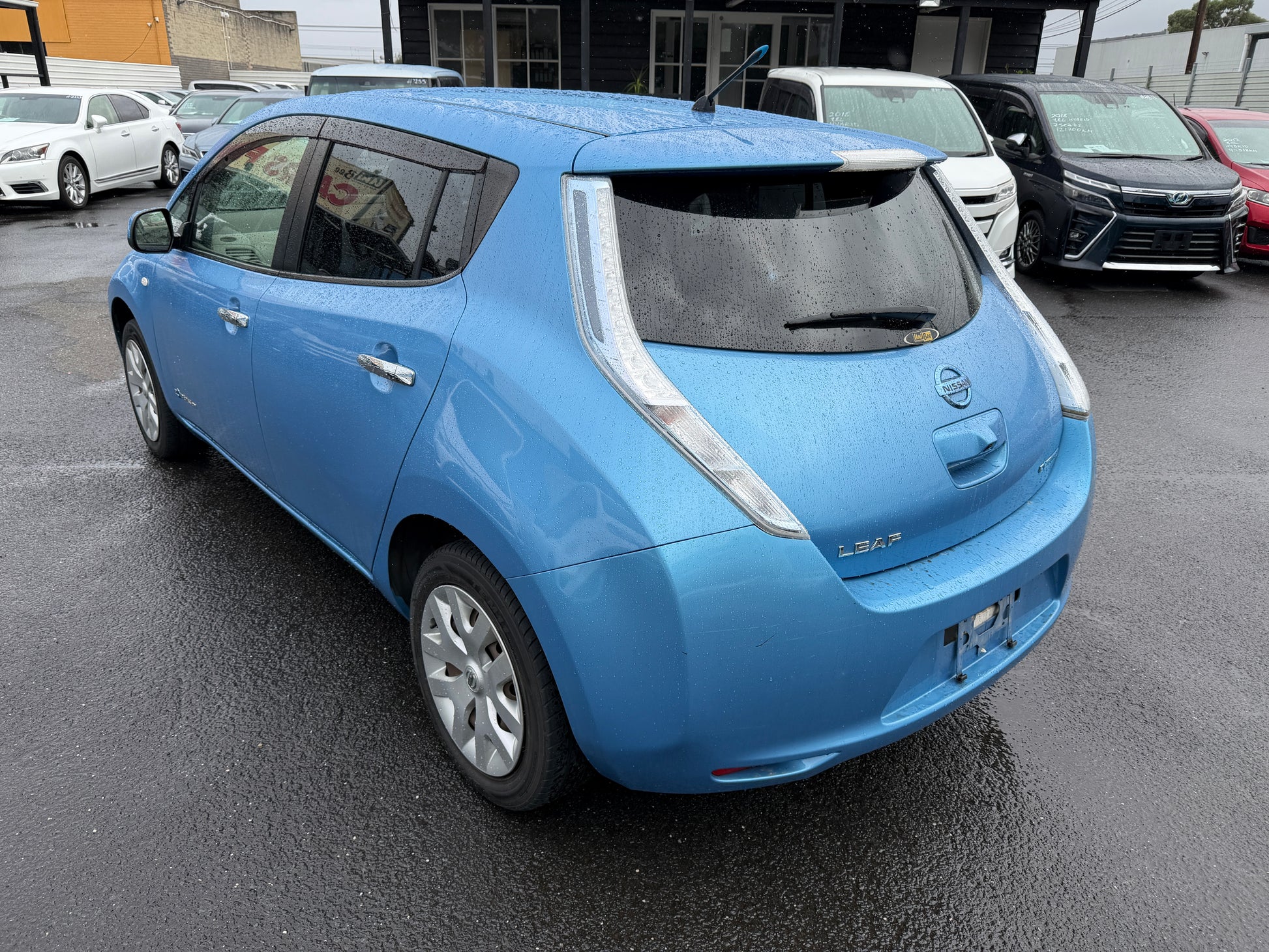 2015 Nissan Leaf 24kW G-Edition Full Electric parked showing rear view with a blue exterior.