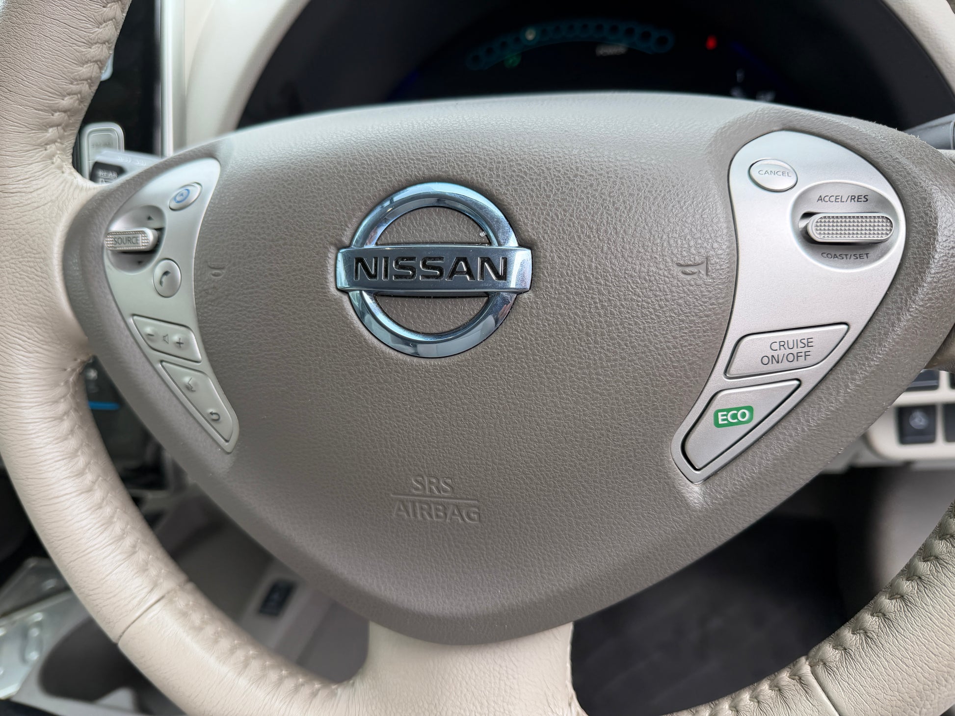 2015 Nissan Leaf 24kW G-Edition Full Electric steering wheel with controls for cruise and eco features.