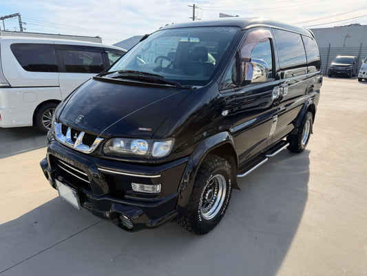 2004 Mitsubishi Delica Space Gear V6 3.0L 4WD black exterior view showing front side profile