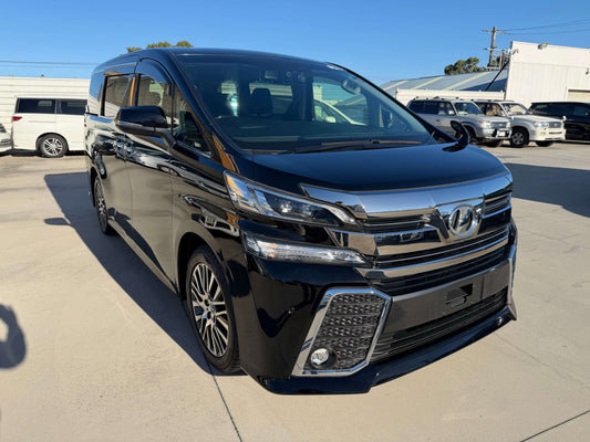2016 Toyota Vellfire V6 3.5L in black color, luxury people mover parked on a sunny day.