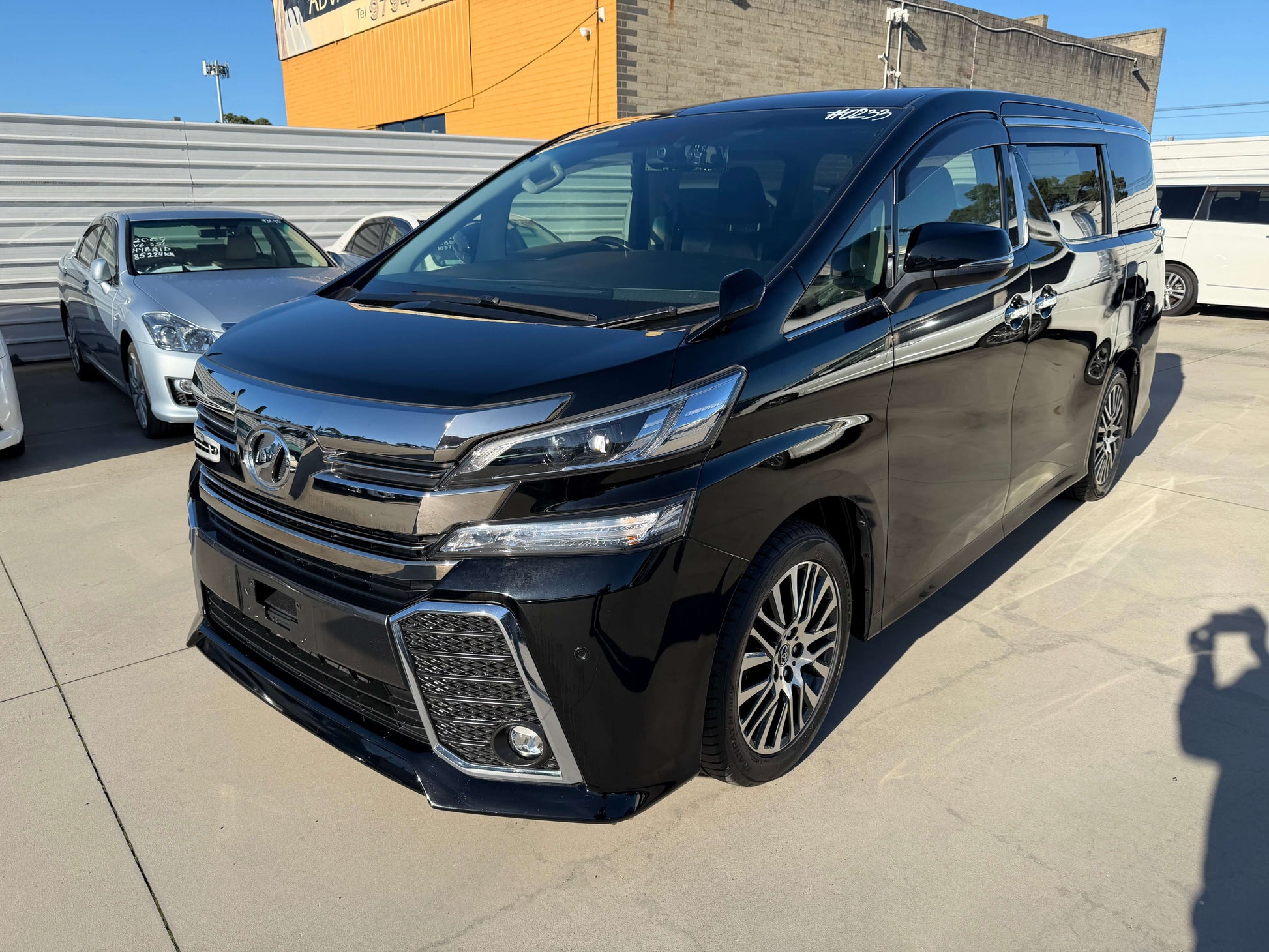 2016 Toyota Vellfire V6 3.5L Luxury People Mover in black with stylish design, showcasing exterior features and premium wheels.
