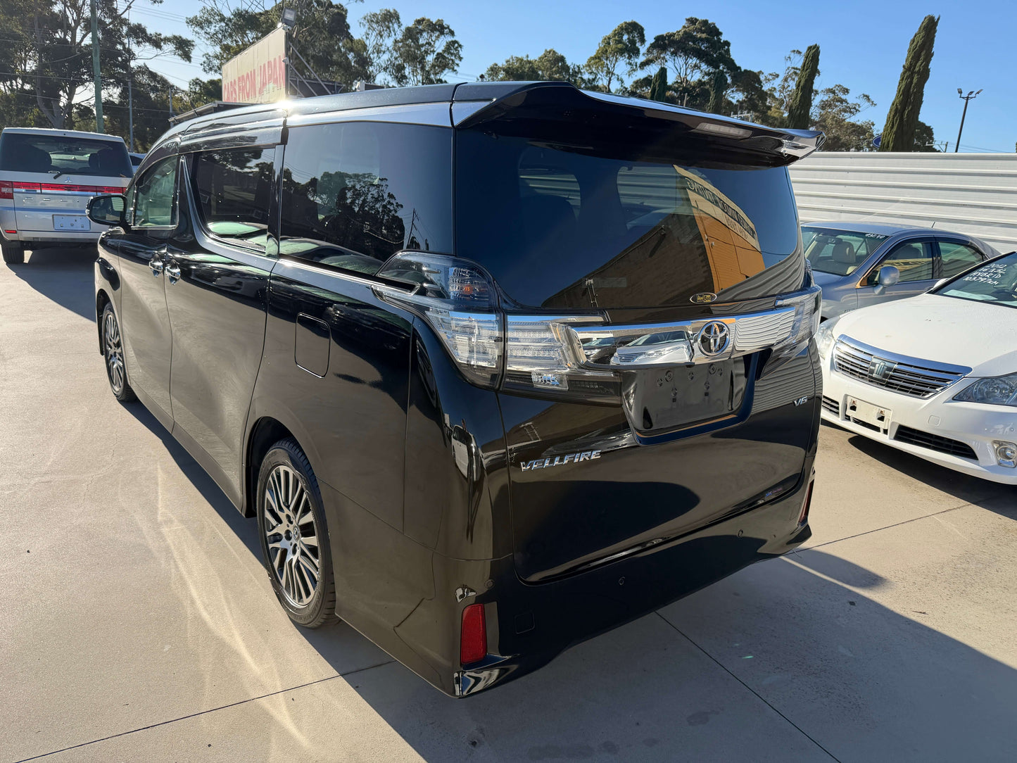 2016 Toyota Vellfire V6 3.5L luxury people mover, rear view showcasing sleek design and modern features.