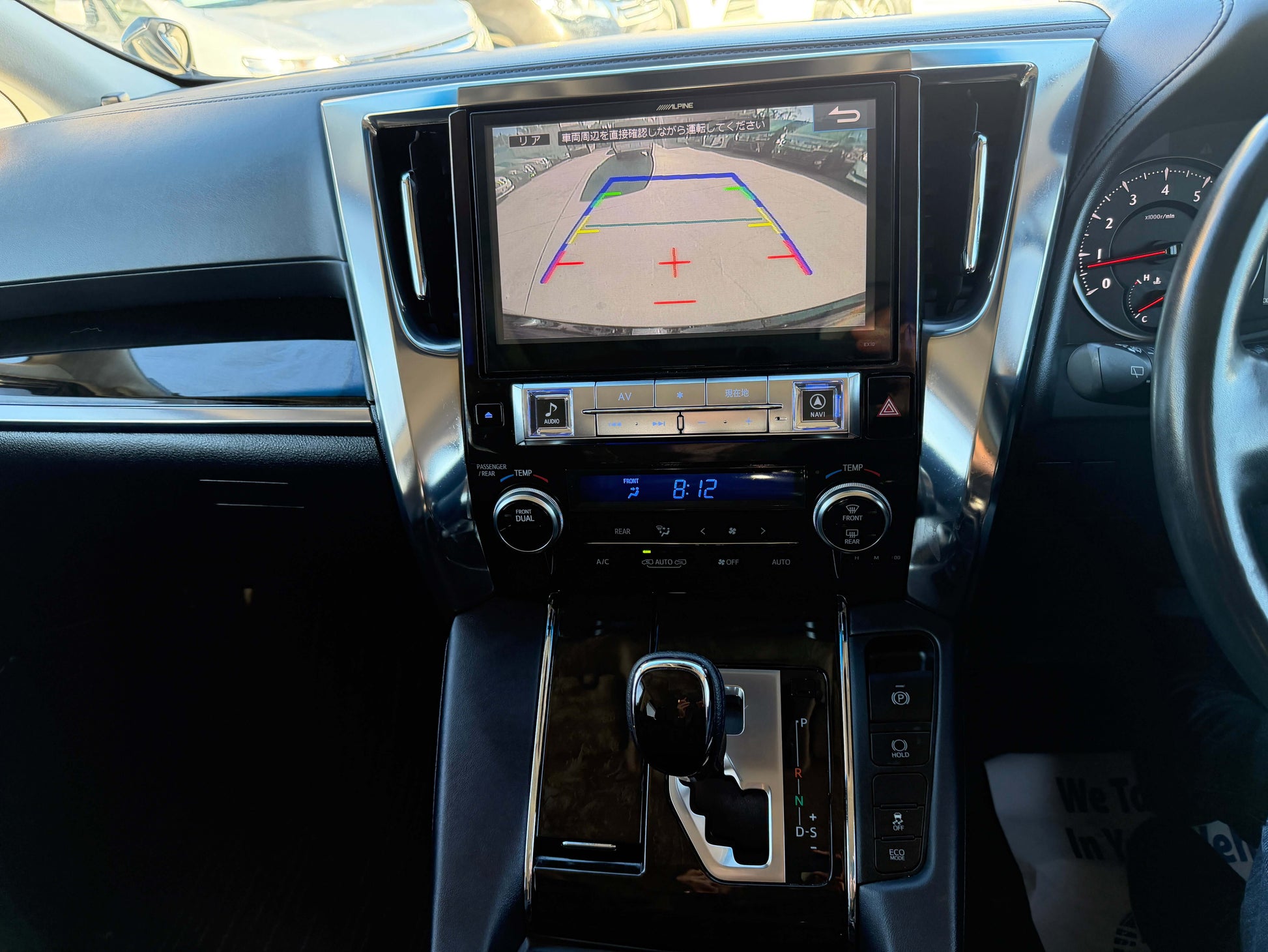 Interior view of 2016 Toyota Vellfire V6 3.5L showing touchscreen display and rearview camera.