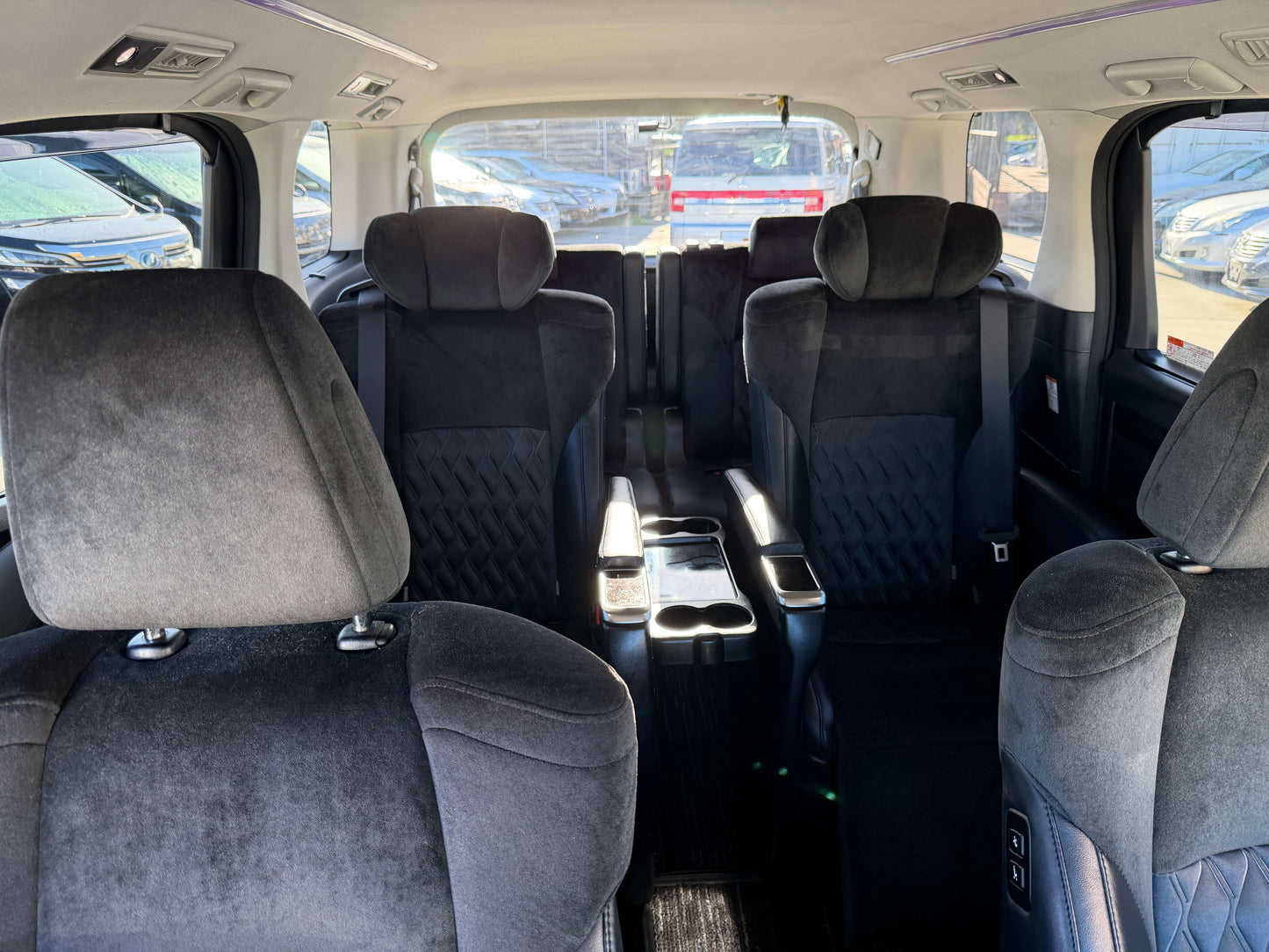 Interior view of 2016 Toyota Vellfire V6 3.5L showing spacious seating for 7, perfect for luxury travel.