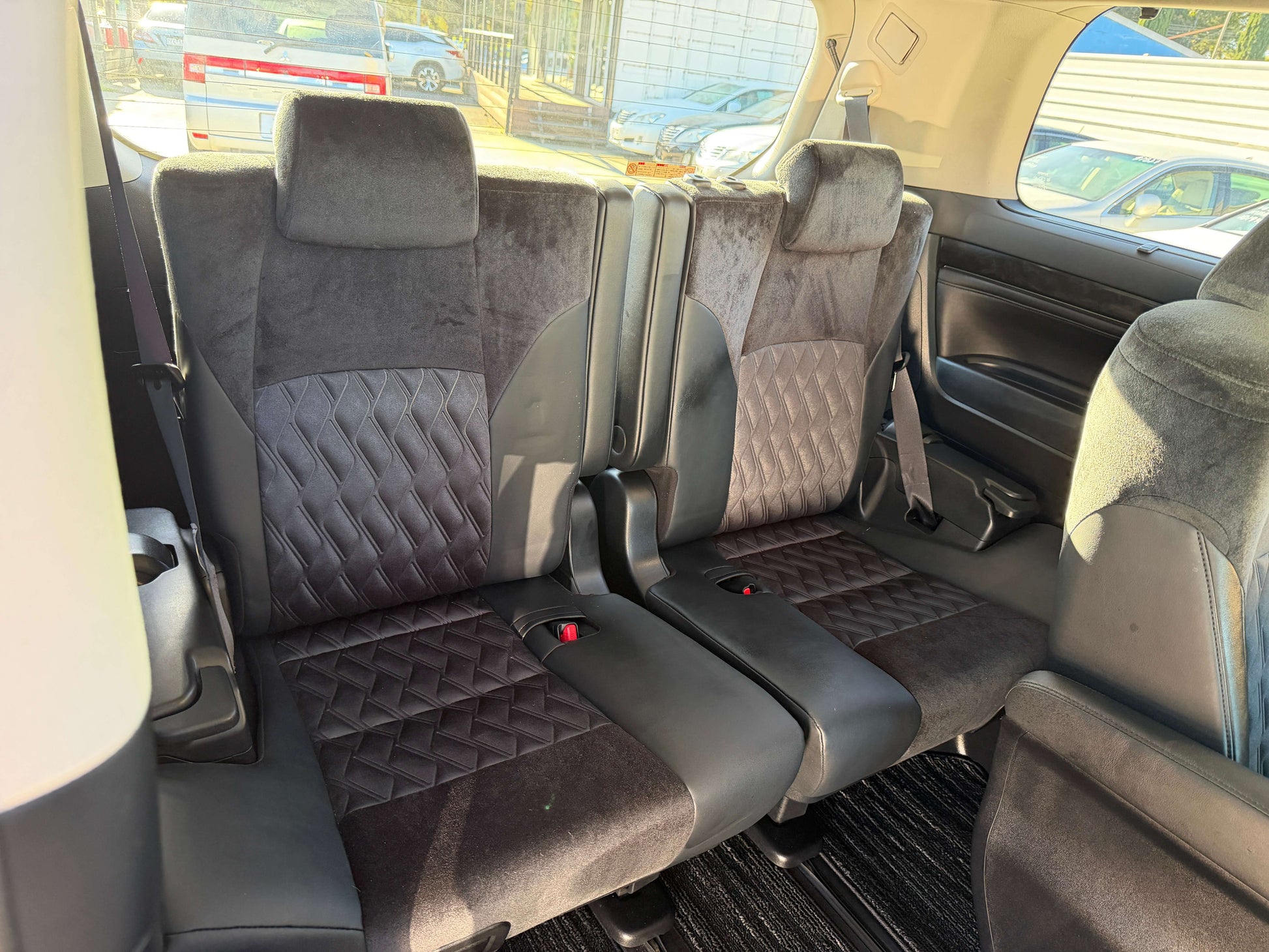Interior seating of the 2016 Toyota Vellfire V6 3.5L showing luxurious leather upholstery in the second row.