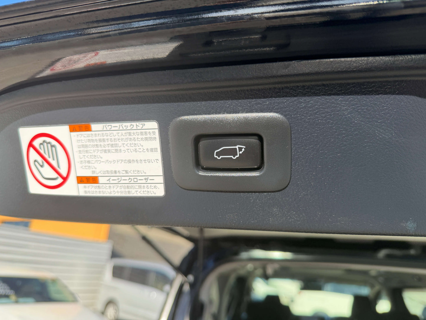2016 Toyota Vellfire V6 3.5L rear trunk release button and warning labels inside vehicle.