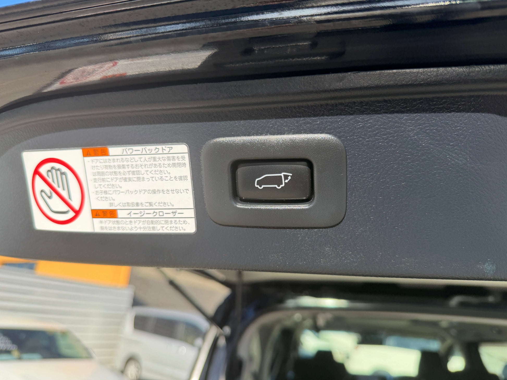 2016 Toyota Vellfire V6 3.5L rear trunk release button and warning labels inside vehicle.