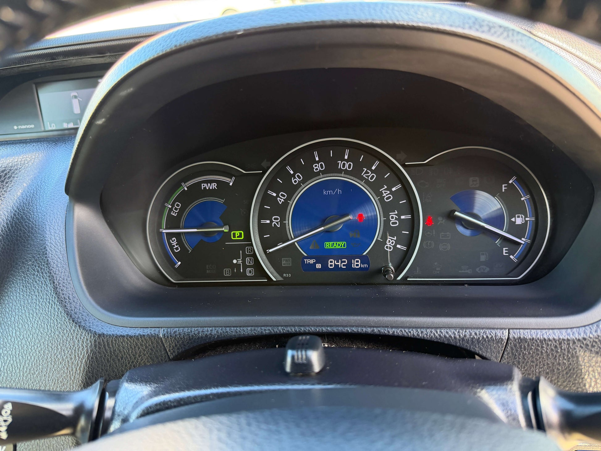 Dashboard display of a 2017 Toyota Noah 1.8L Hybrid with speedometer and fuel gauge.