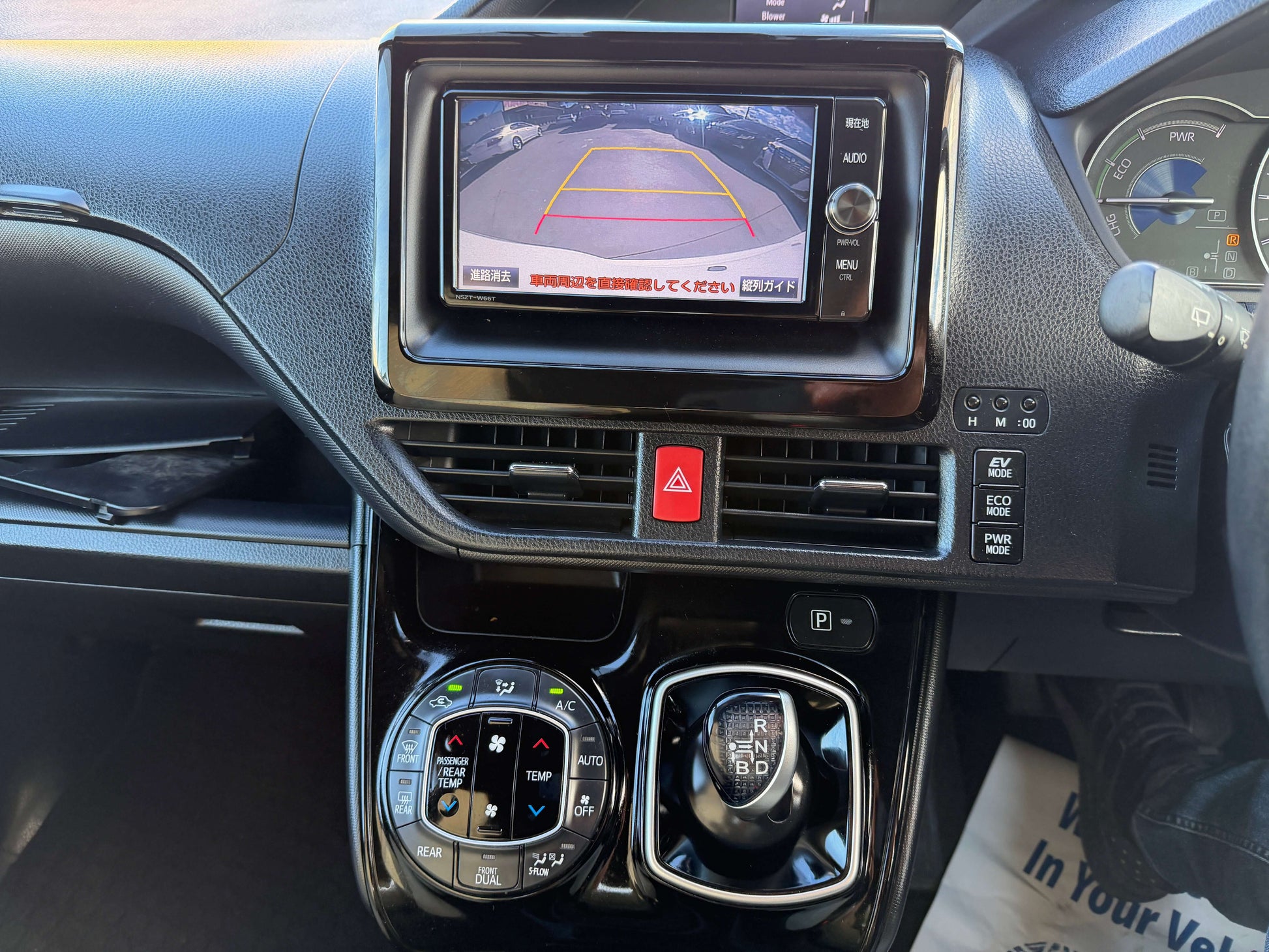 Interior view of 2017 Toyota Noah 1.8L Hybrid showcasing the dashboard and rearview camera display.
