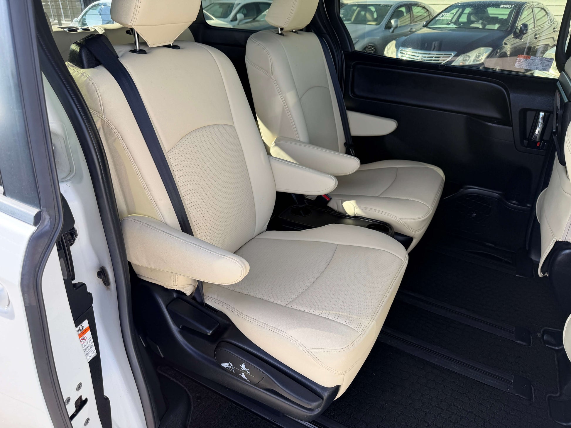 Interior seating of a 2017 Toyota Noah 1.8L Hybrid G Premium Edition, showcasing comfortable beige leather seats.