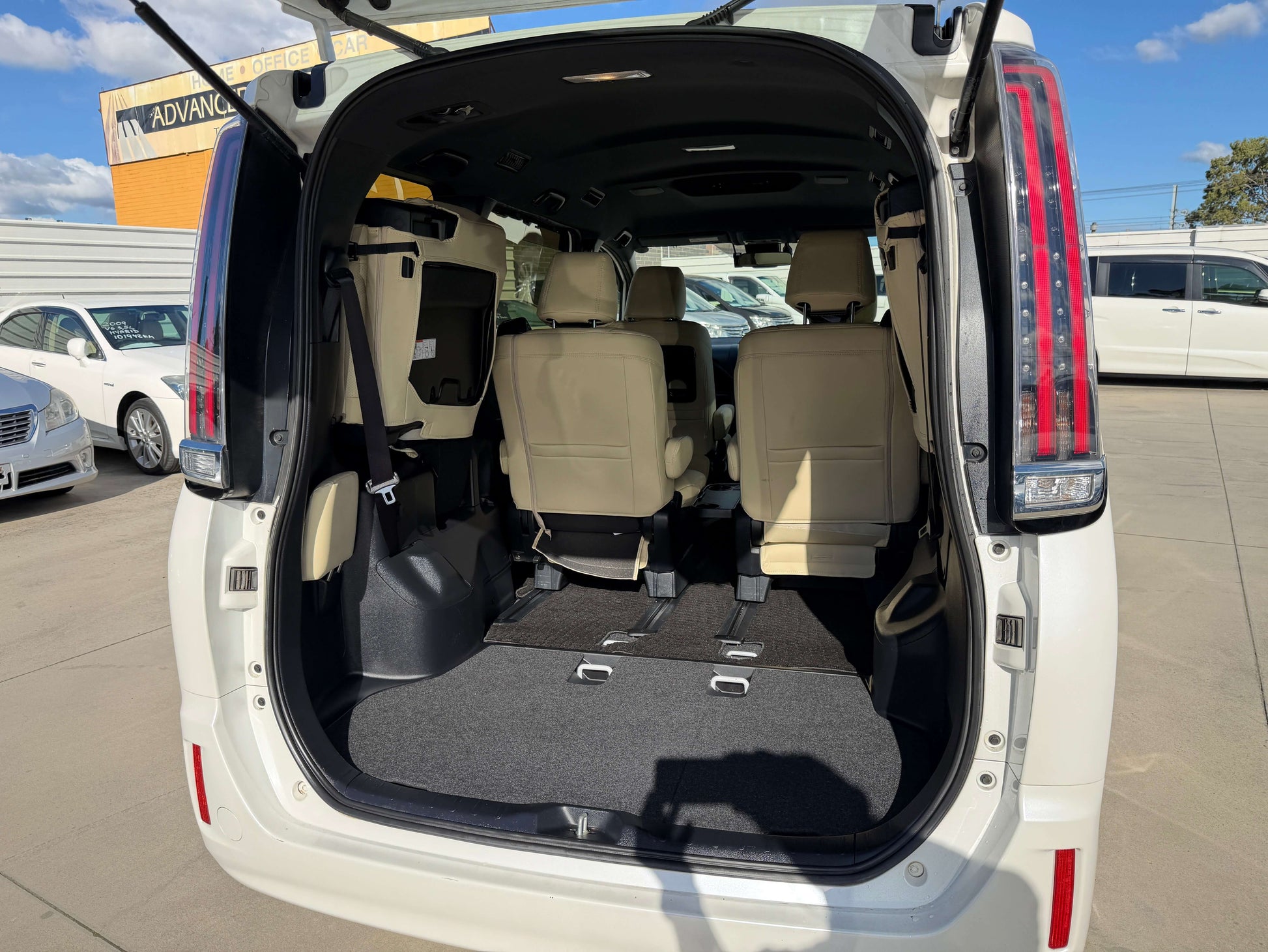 Interior view of the 2017 Toyota Noah 1.8L Hybrid G Premium Edition 7 seater, showcasing spacious seating and cargo area.