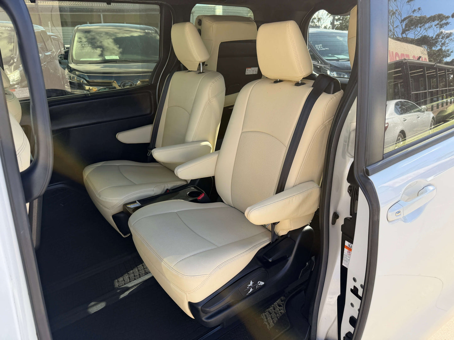 Interior view of the 2017 Toyota Noah 1.8L Hybrid G Premium Edition showcasing comfortable beige seats.
