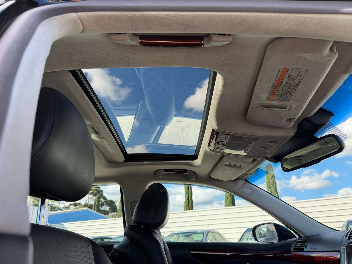 Interior view of 2007 Lexus LS600hL AWD V8 5.0L Hybrid showing panoramic sunroof and luxury seating.