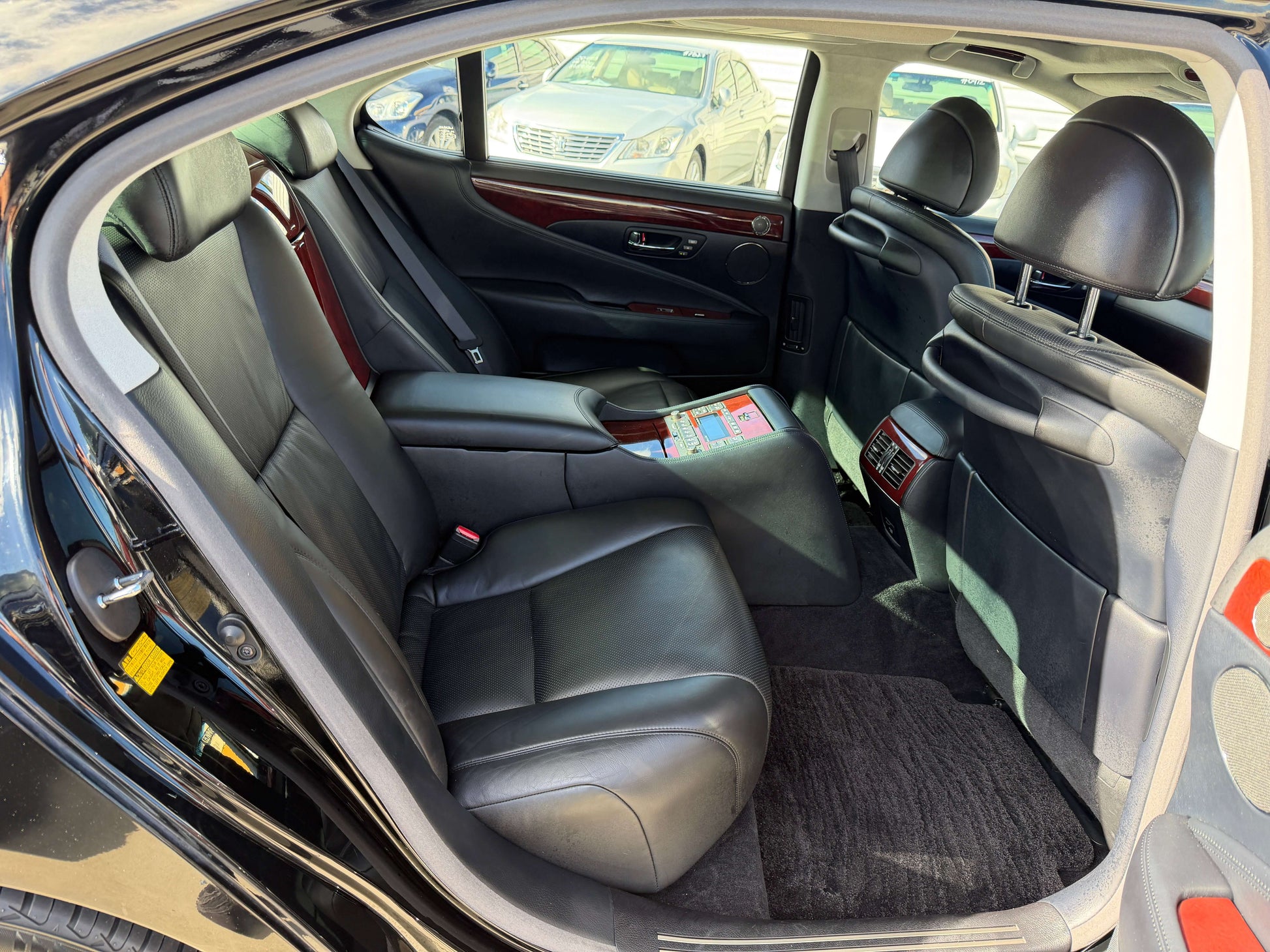 2007 Lexus LS600hL AWD V8 5.0L Hybrid luxury sedan rear interior with separate rear seats.