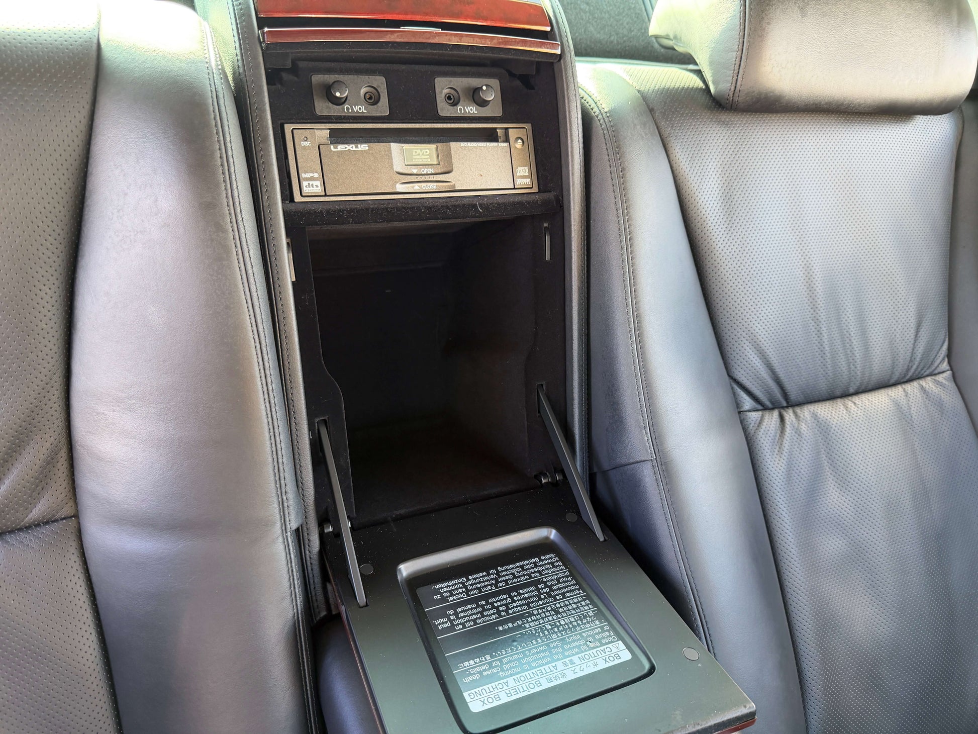 Interior view of rear compartment in 2007 Lexus LS600hL AWD V8 5.0L Hybrid showcasing luxury features and storage.
