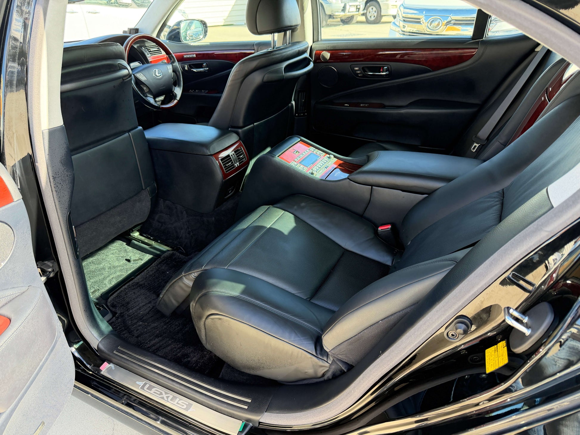Interior view of 2007 Lexus LS600hL AWD V8 5.0L Hybrid luxury sedan showcasing rear seats and cabin features.