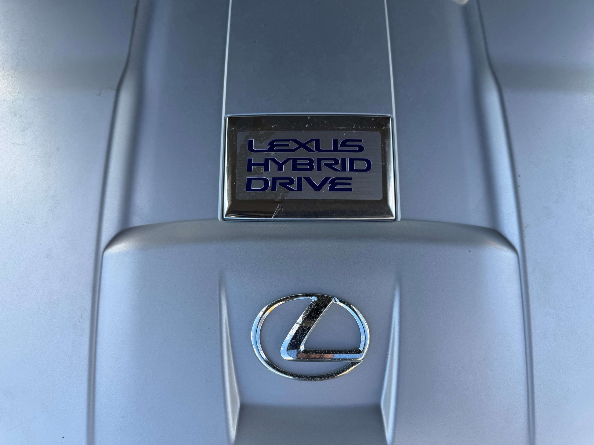 Lexus Hybrid Drive system close-up on the engine cover of a 2007 Lexus LS600hL AWD V8 5.0L Hybrid luxury sedan.