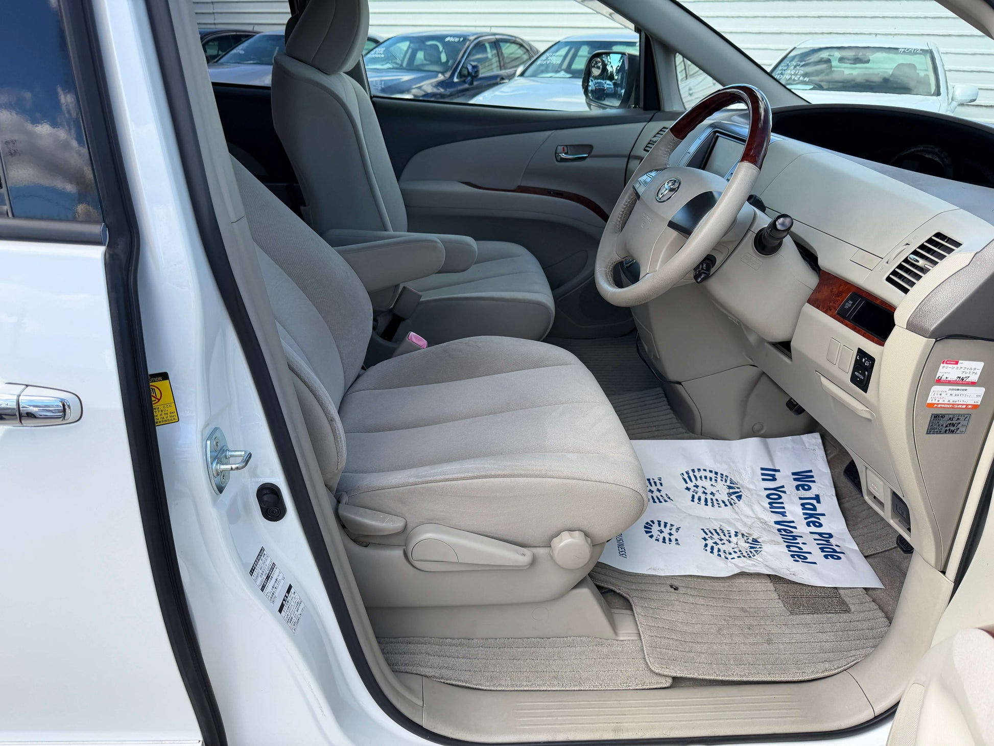 Inside view of 2010 Toyota Estima 2.4L 4WD Aeras G Edition showing spacious seating and dashboard.