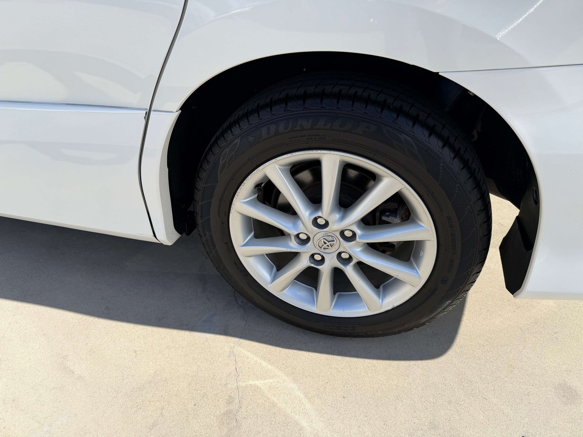Close-up of the wheel of a 2010 Toyota Estima 2.4L 4WD showcasing alloy rims and tire.