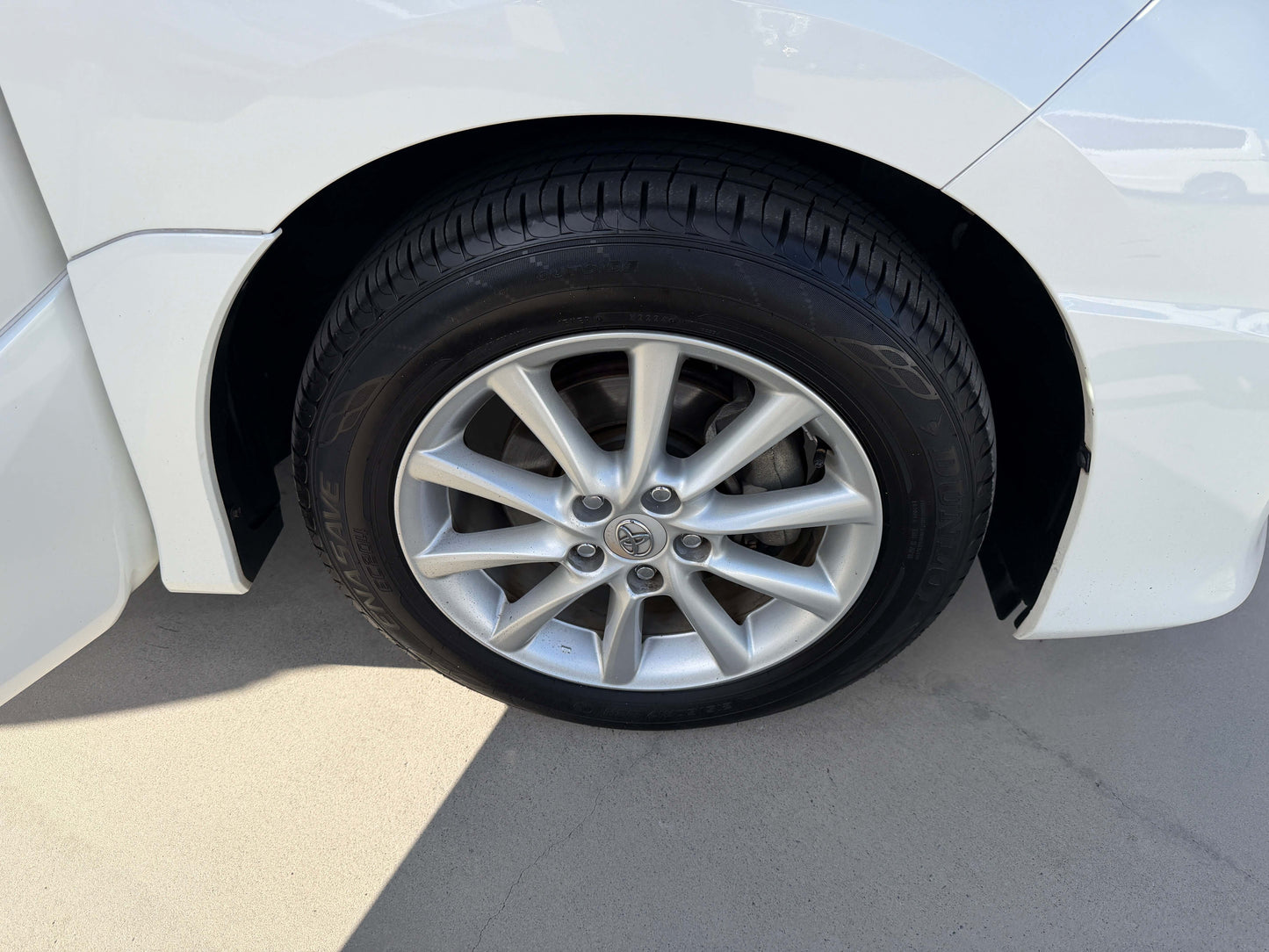 Close-up of the wheel on a 2010 Toyota Estima 2.4L 4WD, showcasing alloy rim and tire.
