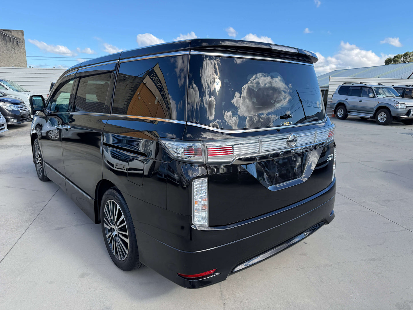 2015 Nissan Elgrand 2.5L 250 Highway Star in black color, 7-seat luxury people mover with polished exterior.