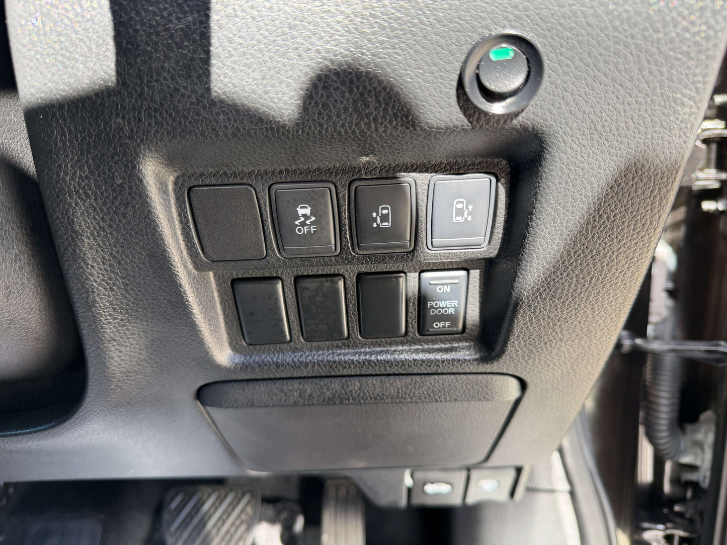 Buttons and controls on the interior dashboard of a 2015 Nissan Elgrand 2.5L 250 Highway Star.