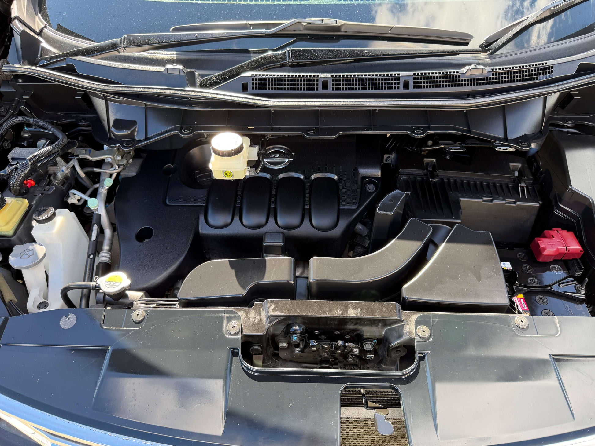 2015 Nissan Elgrand 2.5L engine compartment showing components and layout of the premium people mover.