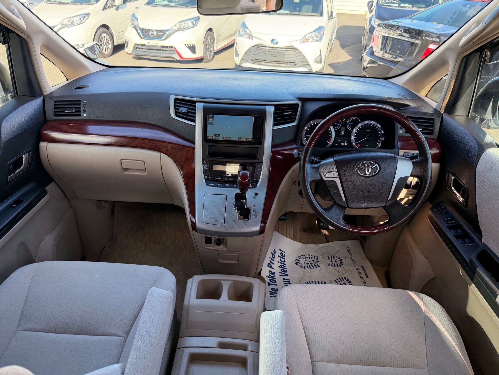 Interior view of a 2009 Toyota Alphard 2.4L G Edition, showcasing dashboard and seating.