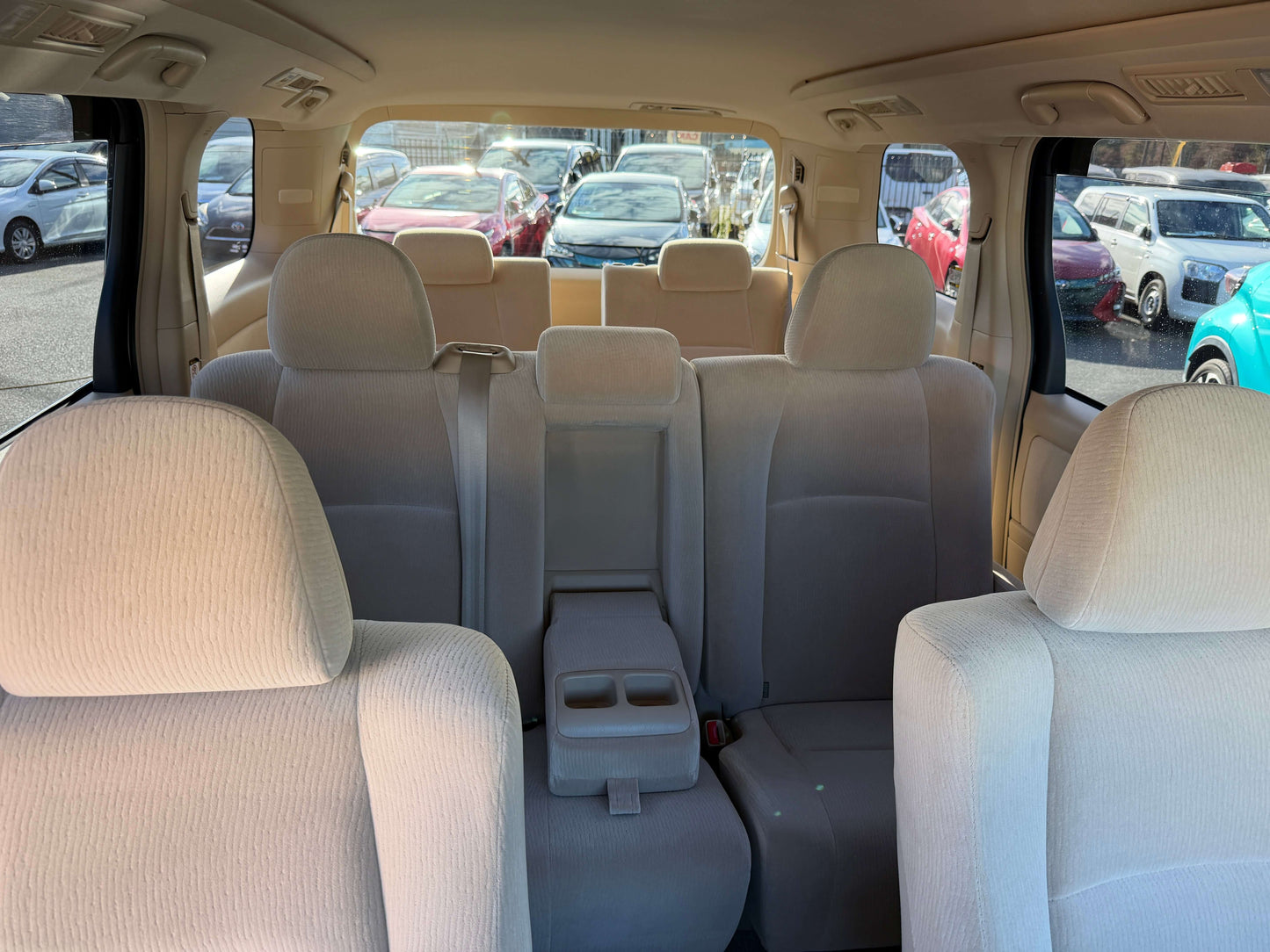 Interior view of a 2009 Toyota Alphard 2.4L with spacious seating for 8 passengers and luxury features.