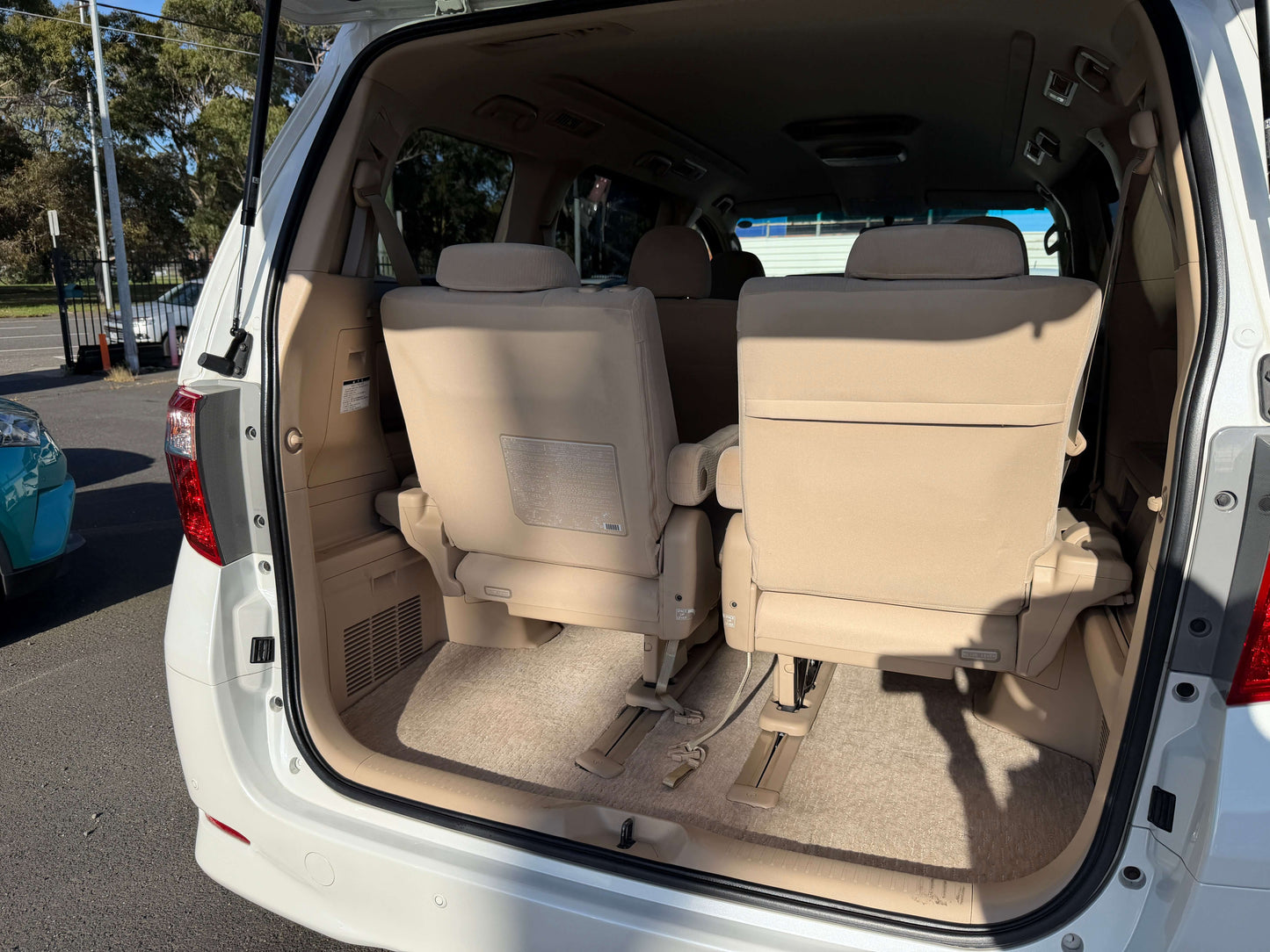 Interior of 2009 Toyota Alphard 2.4L with 8 seats, showcasing spacious back seating area.