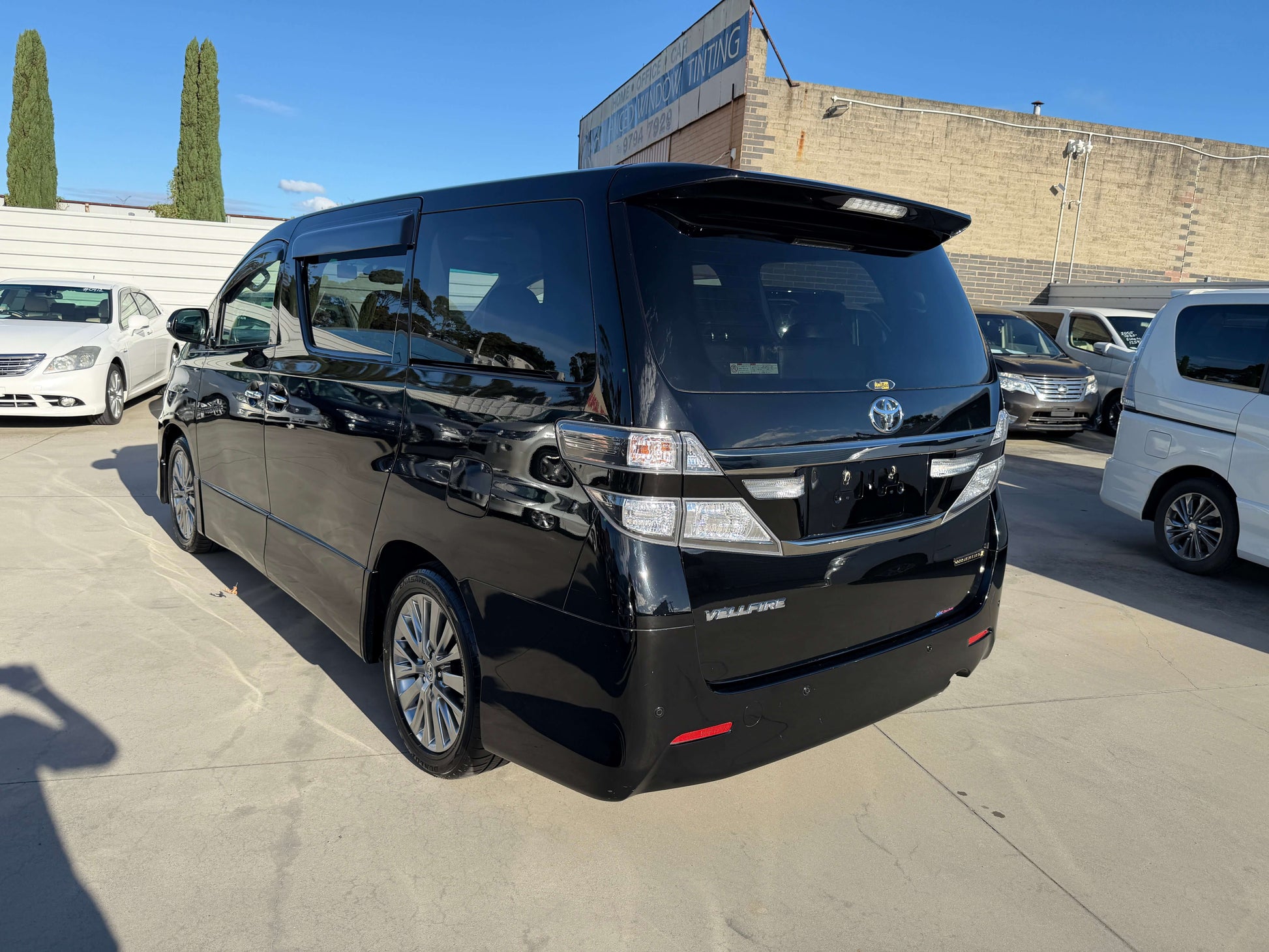 2014 Toyota Vellfire 2.4L Z Golden Eyes II Edition rear view, showcasing its sleek design and spaciousness.