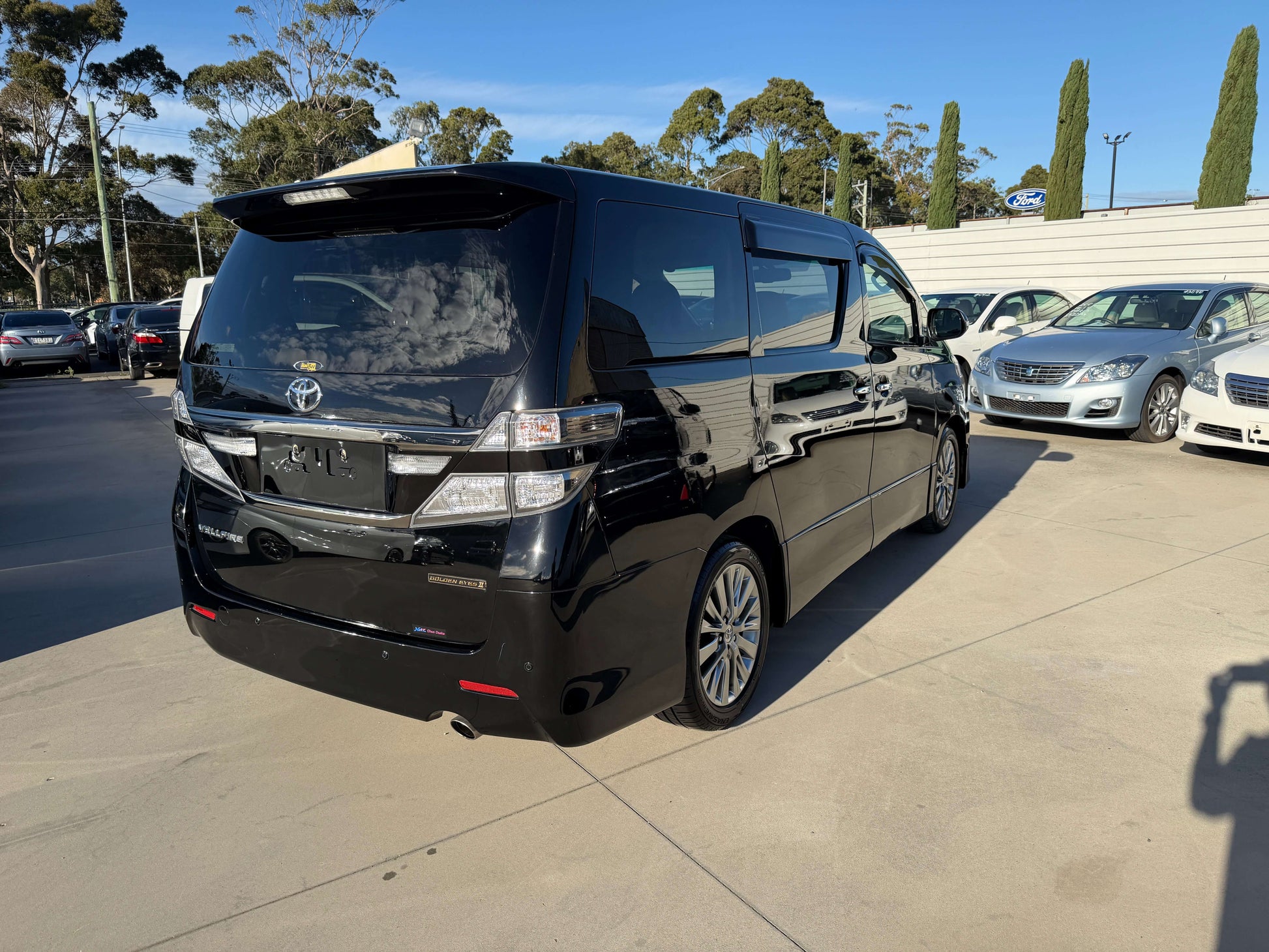 2014 Toyota Vellfire 2.4L Z Golden Eyes II Edition in black, showcasing rear view with spacious design and modern features.