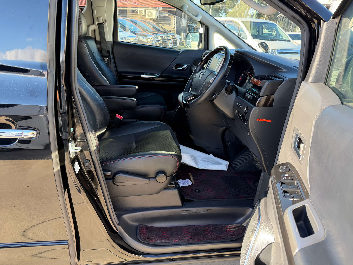 Interior view of 2014 Toyota Vellfire 2.4L Z Golden Eyes II Edition, showcasing black leather seats and dashboard.