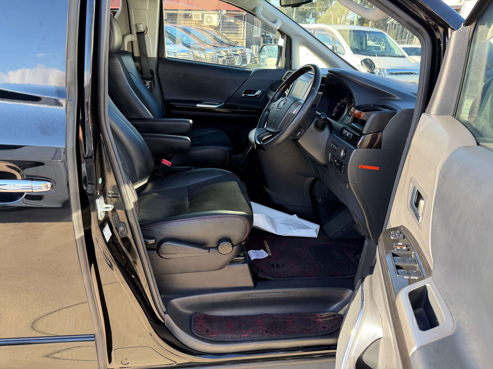 Interior view of 2014 Toyota Vellfire 2.4L Z Golden Eyes II Edition, showcasing black leather seats and dashboard.