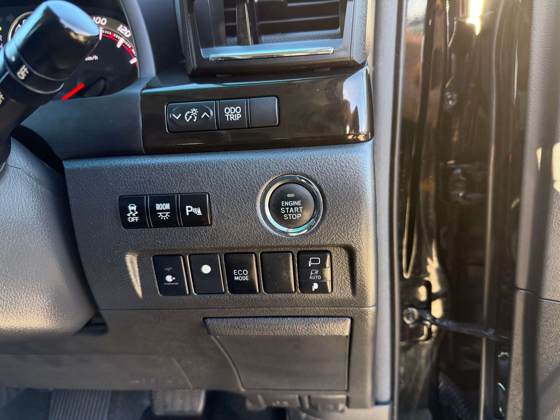 Interior view of 2014 Toyota Vellfire 2.4L dashboard showing start stop button and control switches