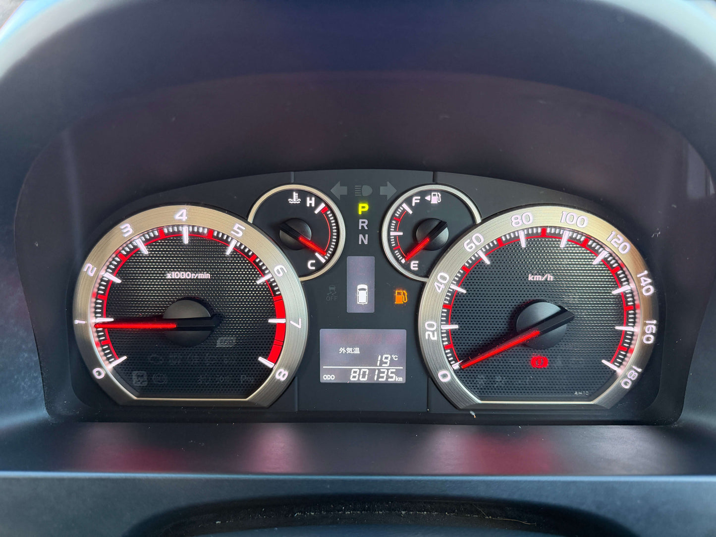 Dashboard of 2014 Toyota Vellfire 2.4L showing speedometer and odometer, mileage at 80135 km.