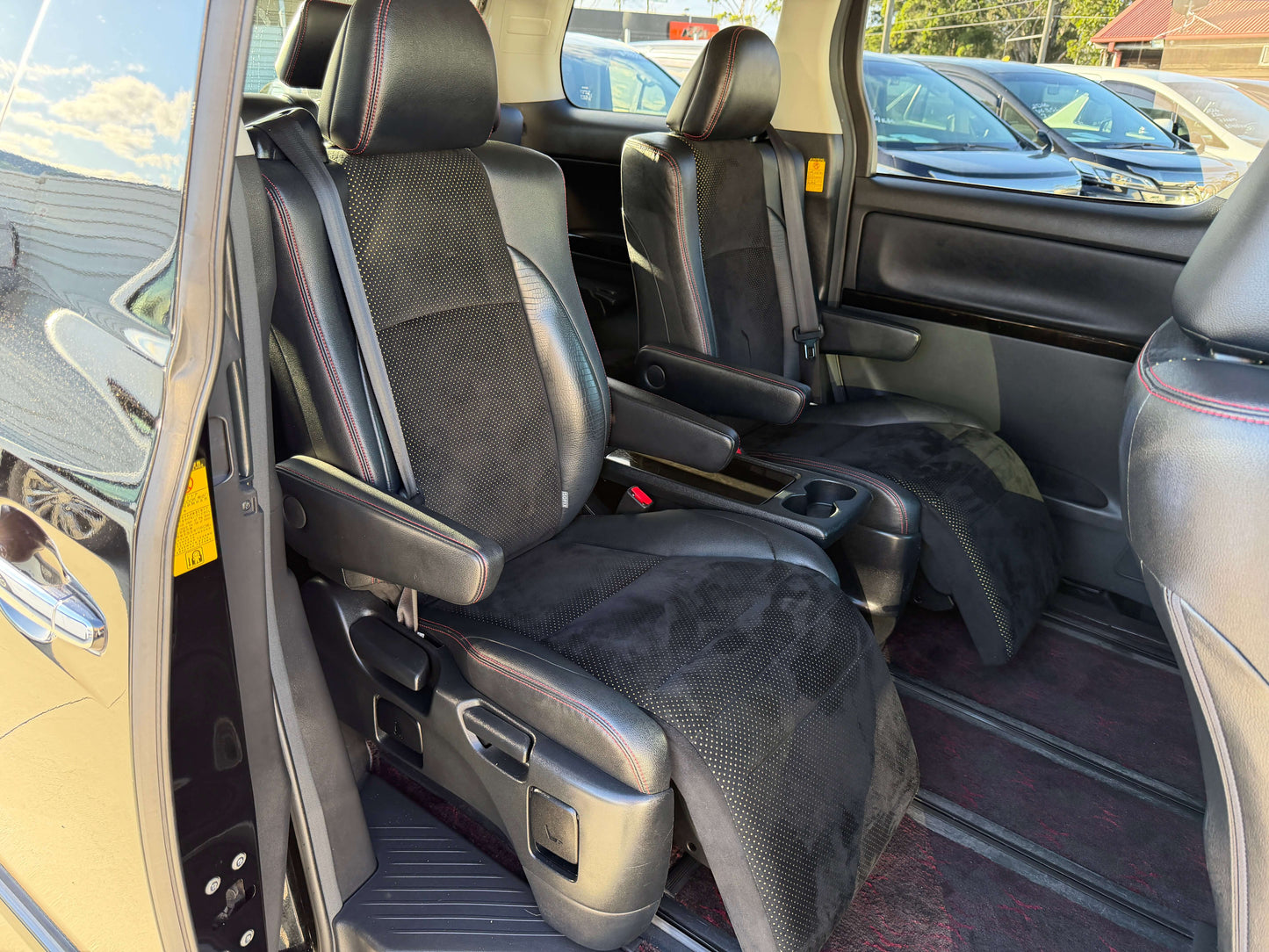 Interior view of 2014 Toyota Vellfire 2.4L Z Golden Eyes II Edition featuring black cloth seats.