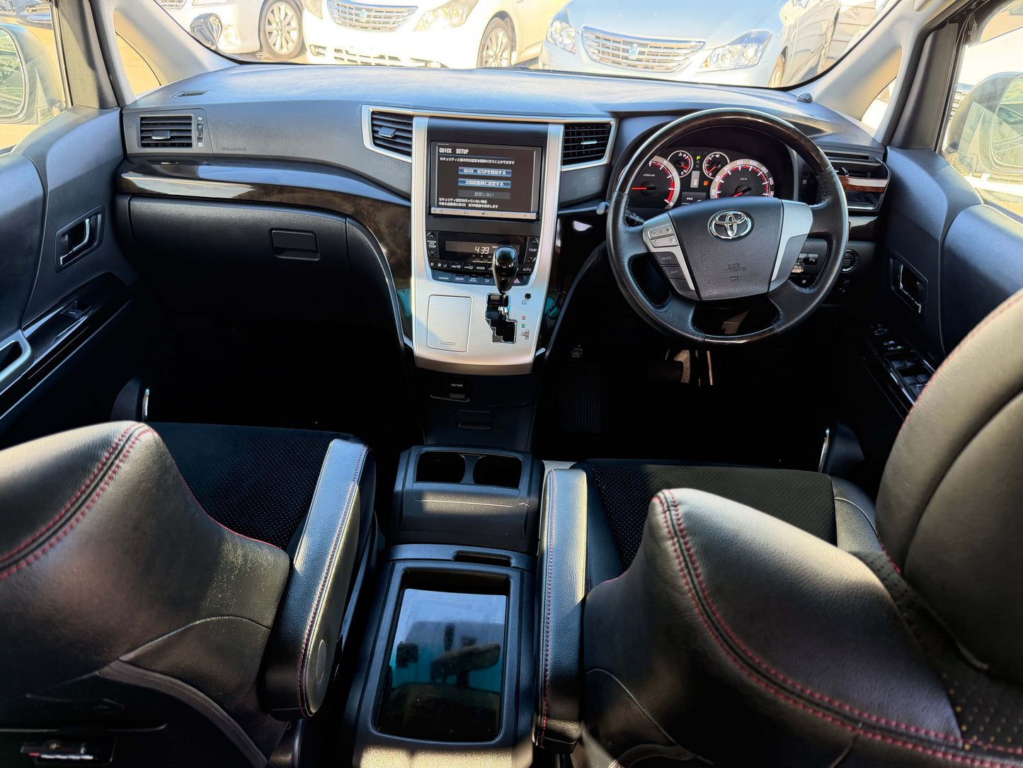 Interior view of 2014 Toyota Vellfire 2.4L Z with leather seats and dashboard features.