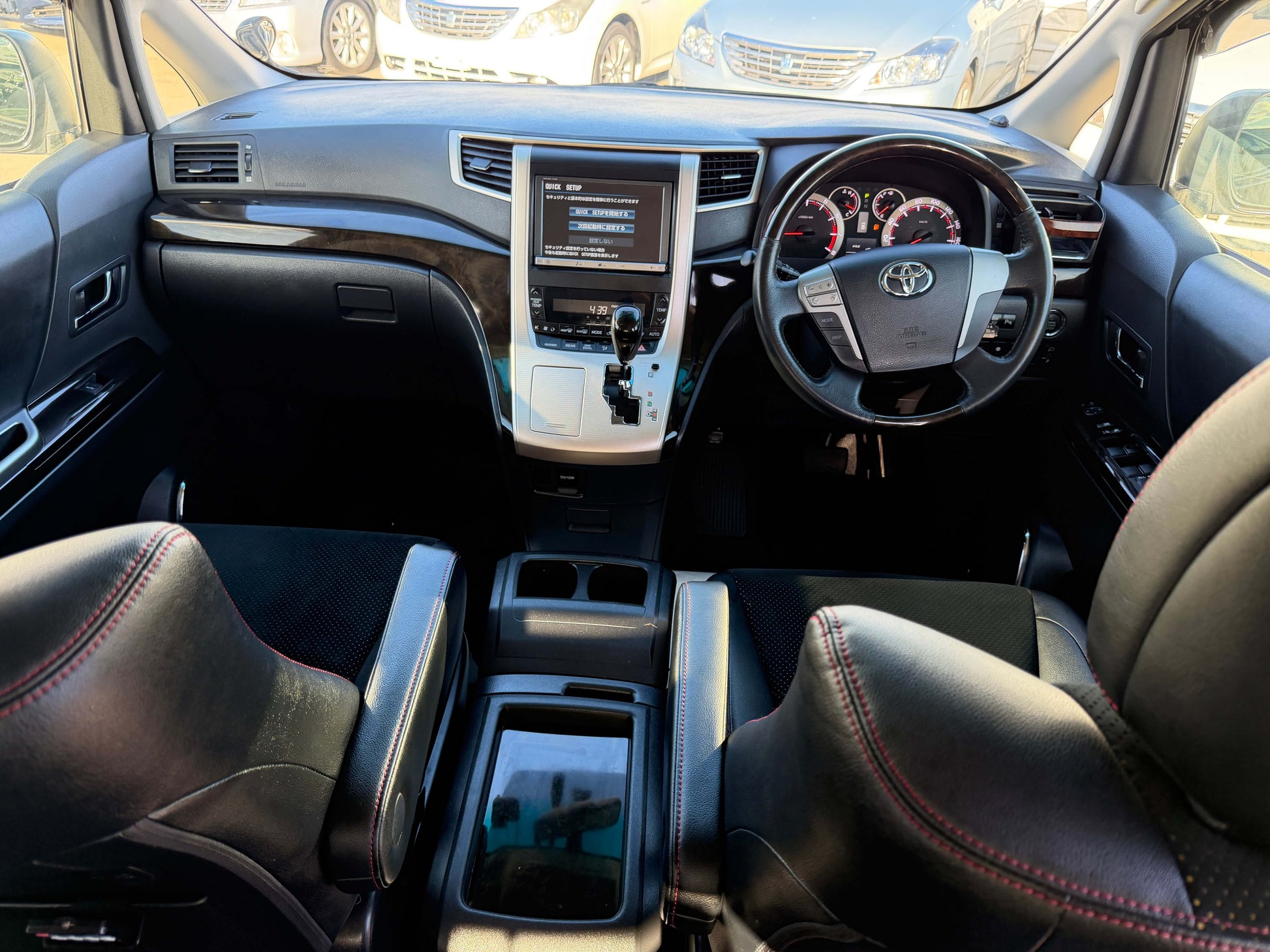Interior view of 2014 Toyota Vellfire 2.4L Z with leather seats and dashboard features.