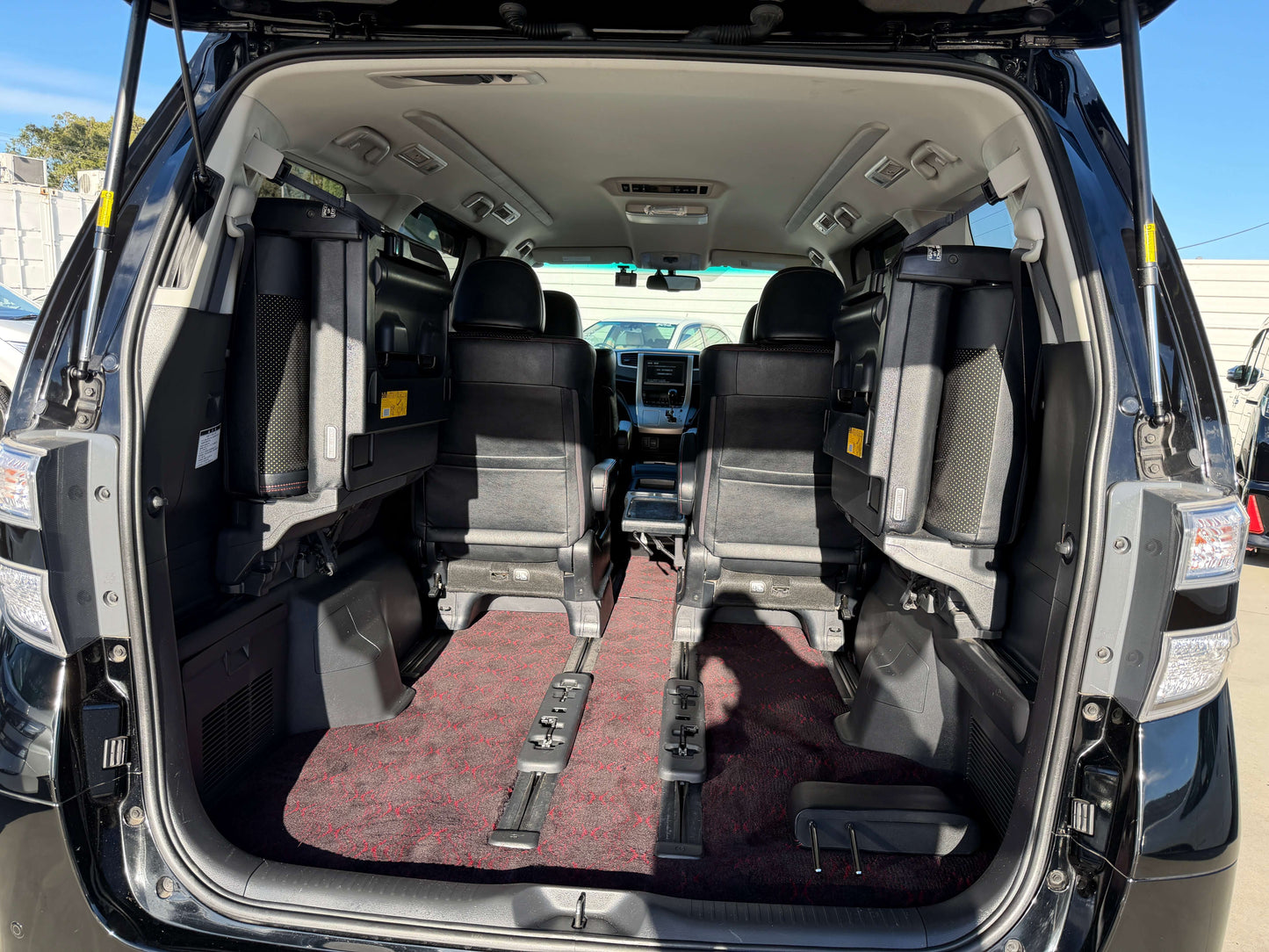 Interior view of 2014 Toyota Vellfire 2.4L Z Golden Eyes II Edition with 7 seats, showcasing rear seating area.