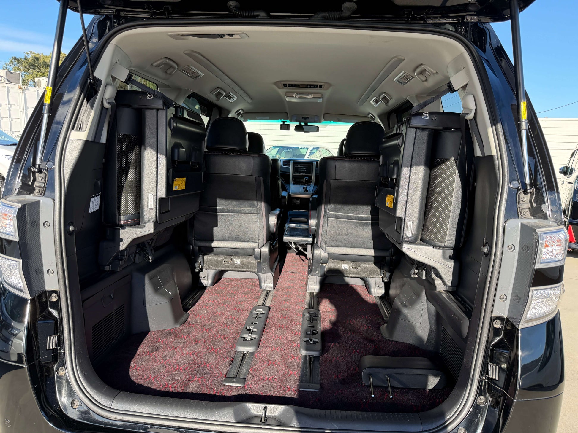 Interior view of 2014 Toyota Vellfire 2.4L Z Golden Eyes II Edition with 7 seats, showcasing rear seating area.
