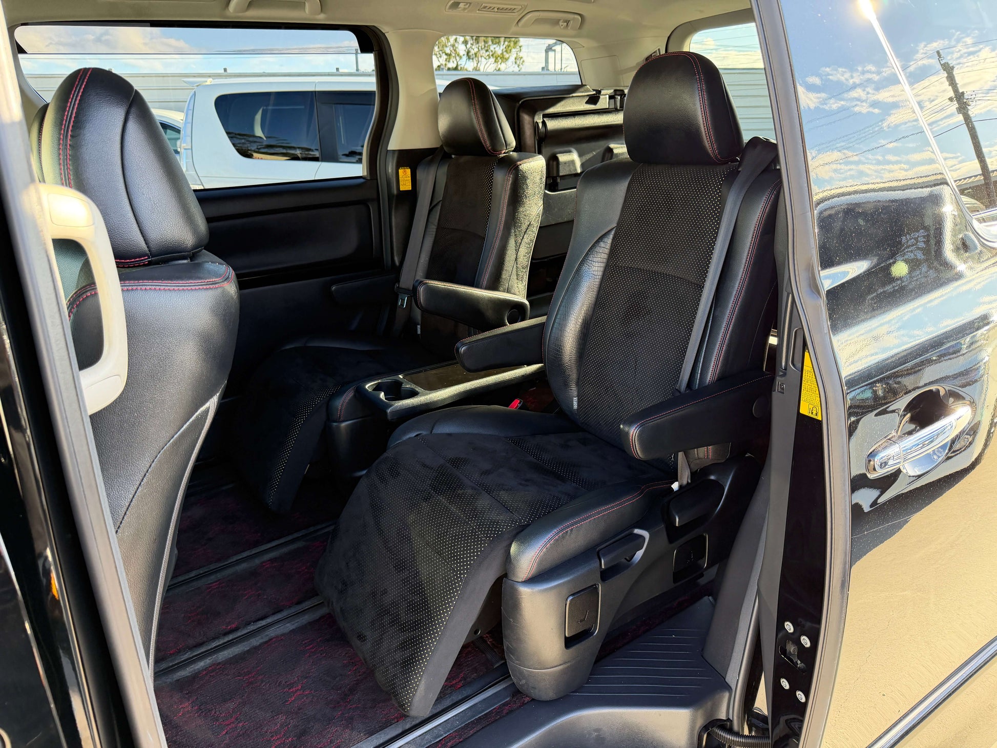 Interior view of the 2014 Toyota Vellfire 2.4L Z Golden Eyes II Edition showing 7 seats and spacious layout.