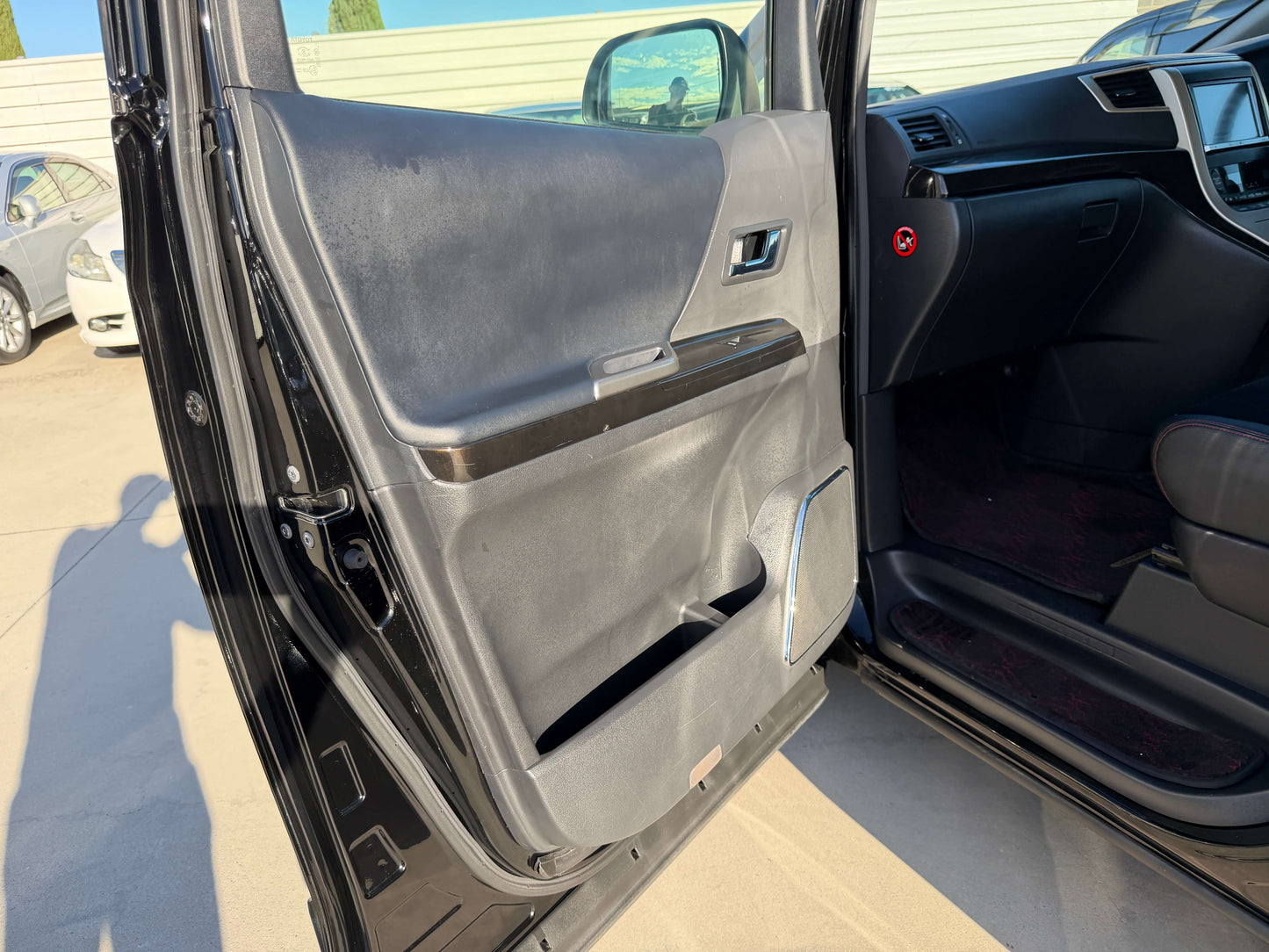 Interior door panel of the 2014 Toyota Vellfire 2.4L Z Golden Eyes II Edition showcasing sleek design.